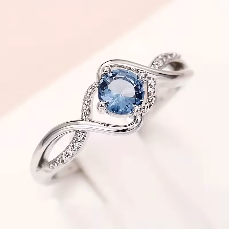 A Minimalist Wave-shaped Blue Synthetic Zirconia Ladies' Ring For Parties, Dances, Daily Wear, And Jewelry Gifts.